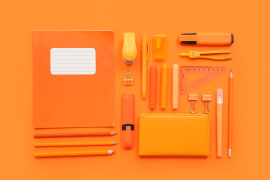 Different stationery on orange background