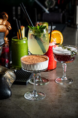 Colorful cocktails and a stunning dessert create an inviting atmosphere, perfect for socializing