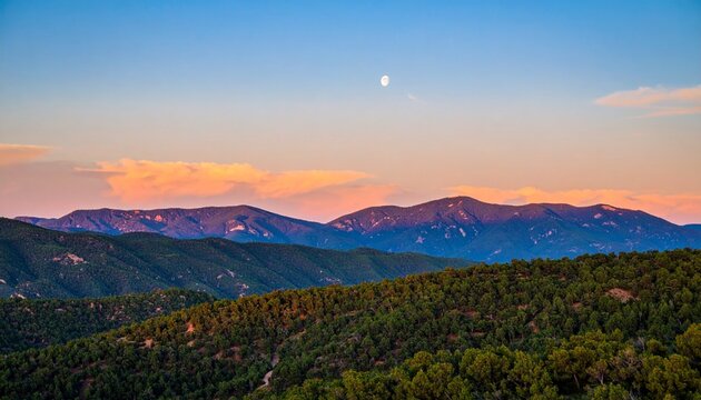 USA, New Mexico, Santa Fe &ndash; Jemez Mountains at Sunset with Crescent Moon in Sky