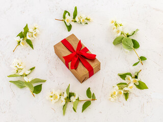 Gift box with flowers on the white background.
