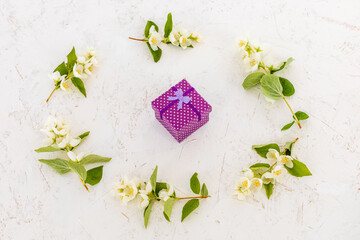 Gift box with flowers on the white background.