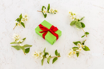 Gift box with flowers on the white background.