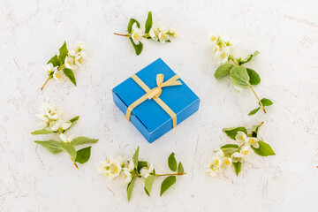 Gift box with flowers on the white background.