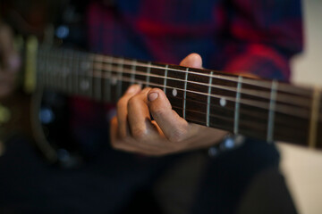 Close-Up of Musician Playing Electric Guitar