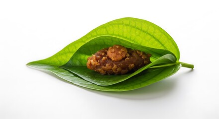 Sweet Treat: Brown Sugar Confection Nestled in Lush Green Betel Leaves