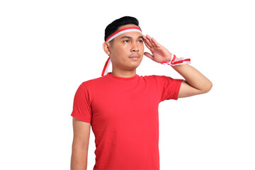 Handsome Asian man giving salute celebrate Indonesian independence day on 17 August isolated on...