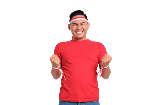 Excited young Asian men celebrate Indonesian independence day on 17 August by raising fists isolated on transparent background