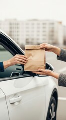 Delivery Service Action Food Hand-off at a Drive-Thru Urban Setting Lifestyle Viewpoint Convenience Concept for Quick Meal Options