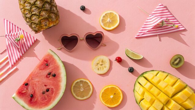 Flatlay of Tropical Fruits With Playful Summer Props on Bright Background Highlighting Fun and Fresh Energy
