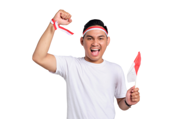Excited young Asian man celebrate Indonesian independence day on 17 August by holding the Indonesian flag isolated on transparent background