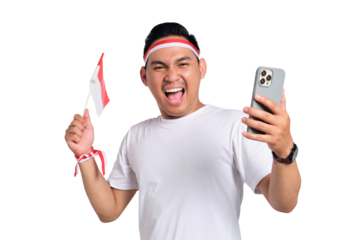 Excited young Asian men celebrate Indonesian independence day on 17 August while holding the Indonesian flag and mobile phone isolated on transparent background