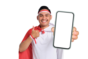 Happy handsome Asian man celebrate Indonesian independence day on 17 August while holding smartphone with blank screen and gesturing thumbs up isolated on transparent background