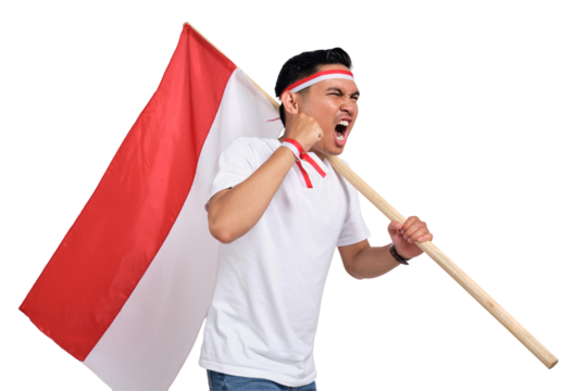 Excited young Asian man celebrate Indonesian independence day on 17 August by holding the Indonesian flag isolated on transparent background
