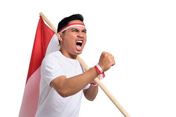 Excited young Asian man celebrate Indonesian independence day on 17 August by holding the...