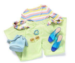 Stylish female spring outfit with accessories and jewellery isolated on white background