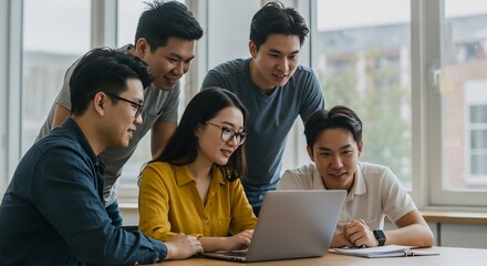 Young Asian Team Collaborating on Laptop, Brainstorming Ideas, Modern Office Workspace, Startup Business