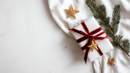 White Gift Box Decorated with Gold Stars and Red Ribbon