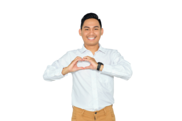 Romantic concept. Happy young Asian man in formal wear showing heart shape with hands, smiling at camera, love confession isolated on transparent background