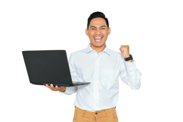 Portrait of excited young Asian man in formal wear holding laptop and making winner gesture with clenched fist isolated on transparent background