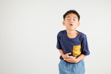 Portrait of Asian young kid boy has stomachache, primary child abdominal pain suffering from...