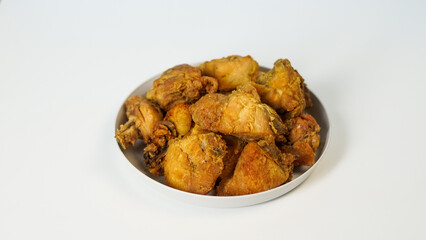 Golden-Brown Fried Chicken Pieces on a Plate