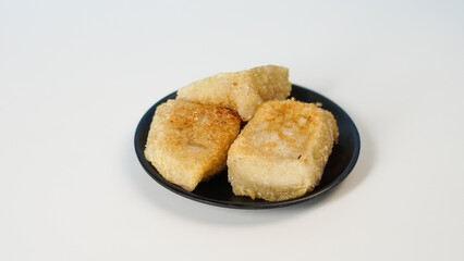 Golden-Brown Baked Goods on Dark Plate