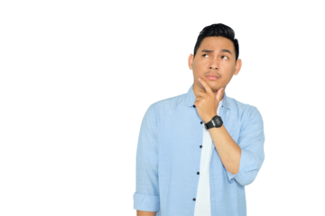Portrait of pensive young Asian man in casual clothes looking up with hand on chin, thinking and making decision isolated on transparent background