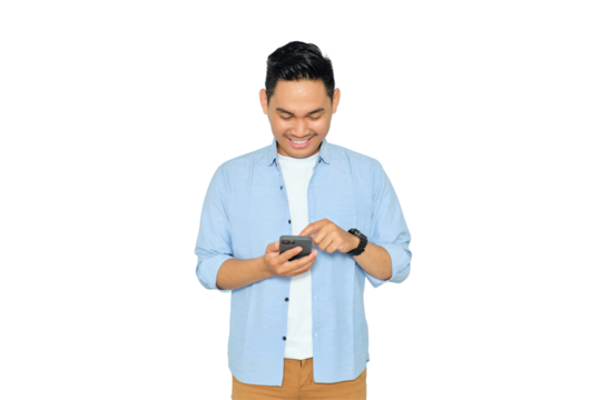 Happy young Asian man in casual clothes using mobile phone for texting message or checking social media isolated on transparent background