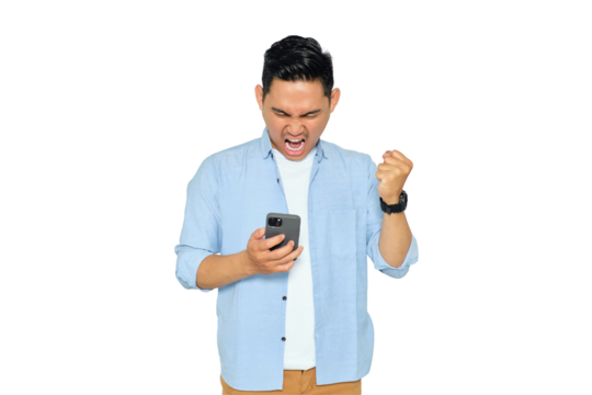 Happy young Asian man in casual clothes using mobile phone for trading or chatting and making winning gesture isolated on transparent background
