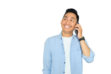 Smiling young Asian man in casual clothes talking on mobile phone and looking aside with happy expression isolated on transparent background
