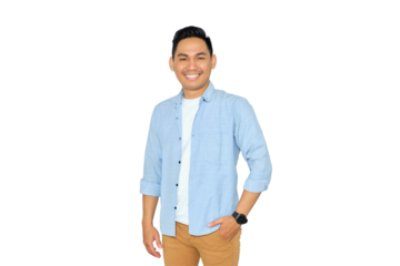 Smiling young Asian man in casual clothes posing with hands in pockets and confidently looking at camera isolated on transparent background