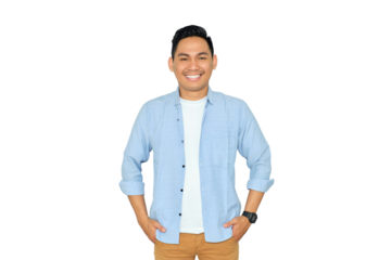 Smiling young Asian man in casual clothes posing with hands in pockets and confidently looking at camera isolated on transparent background