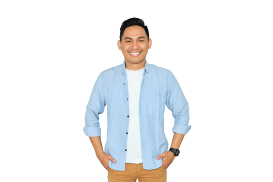Smiling young Asian man in casual clothes posing with hands in pockets and confidently looking at camera isolated on transparent background