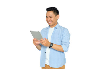 Happy young Asian man in casual clothes using digital tablet, reading news, surfing internet and watching videos isolated on transparent background