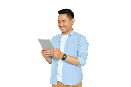 Happy young Asian man in casual clothes using digital tablet, reading news, surfing internet and watching videos isolated on transparent background