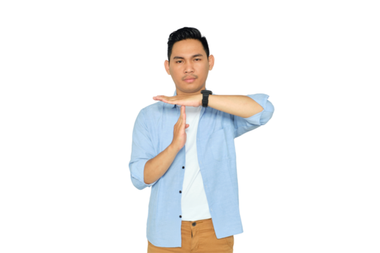 Handsome Asian young man in casual clothes showing time out gesture with serious face isolated on transparent background
