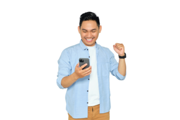 Happy young Asian man in casual clothes using mobile phone for trading or chatting and making winning gesture isolated on transparent background