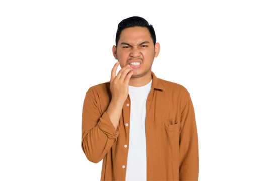 Dental problems. Unhappy young Asian man in casual shirt suffering from severe toothache, touching his cheek isolated on transparent background