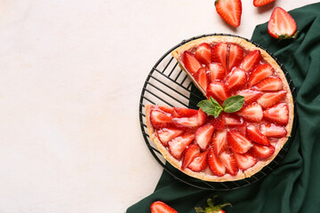 Stand of cut sweet strawberry tart with mint on white background