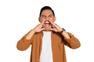Portrait of angry young Asian man in casual shirt loudly screaming widely opening mouth holding hands near mouth isolated on transparent background