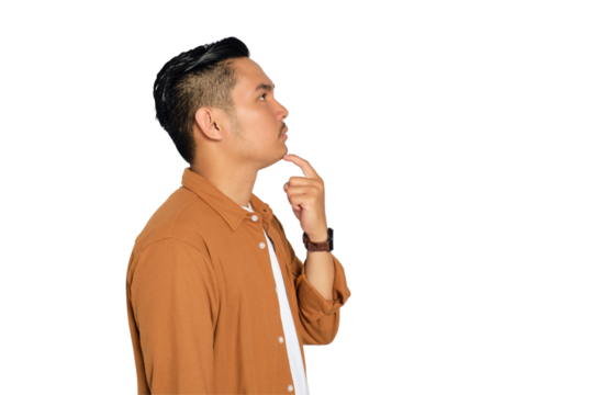 Thoughtful young Asian man in casual shirt touching his chin, looking up, thinking and making decisions isolated on transparent background