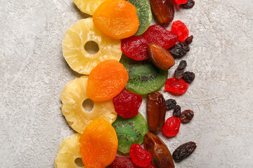 Different candied fruits on grey background