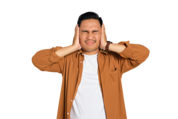 Irritated young Asian man in casual shirt covering his ears with hands, disturbed by loud noise isolated on transparent background