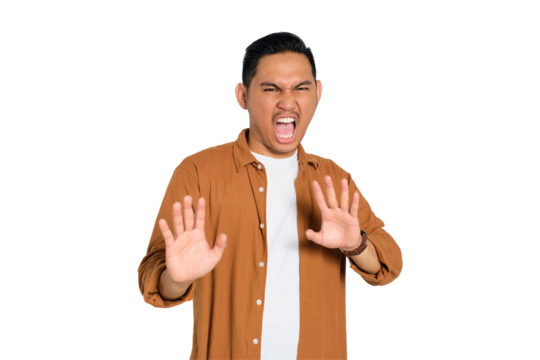 Say no. Annoyed young Asian man in casual shirt making stop gesture with hand isolated on transparent background - Powered by Adobe