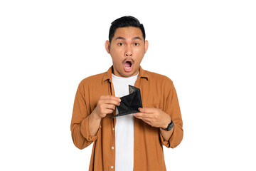 No money. Shocked young Asian man in casual shirt showing empty wallet, having financial problems...