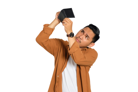 No money. Unhappy young Asian man in casual shirt looking at empty wallet, having financial problems isolated on transparent background