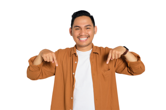 Happy young Asian man in casual shirt pointing finger down and smiling at camera isolated on transparent background - Powered by Adobe