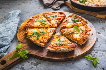 Fresh homemade Italian pizza with ham and buffalo mozzarella