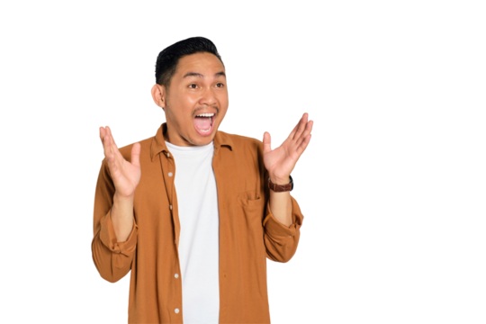 Surprised young Asian man in casual shirt raising hands in excitement, reacting to discount isolated on transparent background - Powered by Adobe