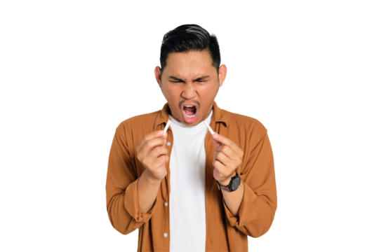 Quit smoking. Angry young Asian man in casual shirt breaking cigarette and saying no to smoking isolated on transparent background - Powered by Adobe